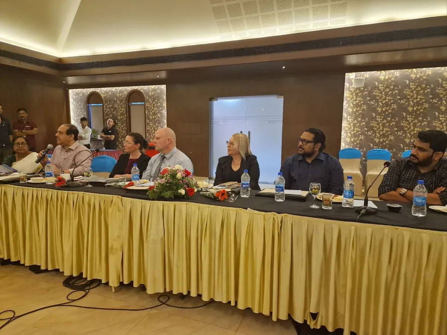 Finnish and Indian delegates at a round-table meeting.