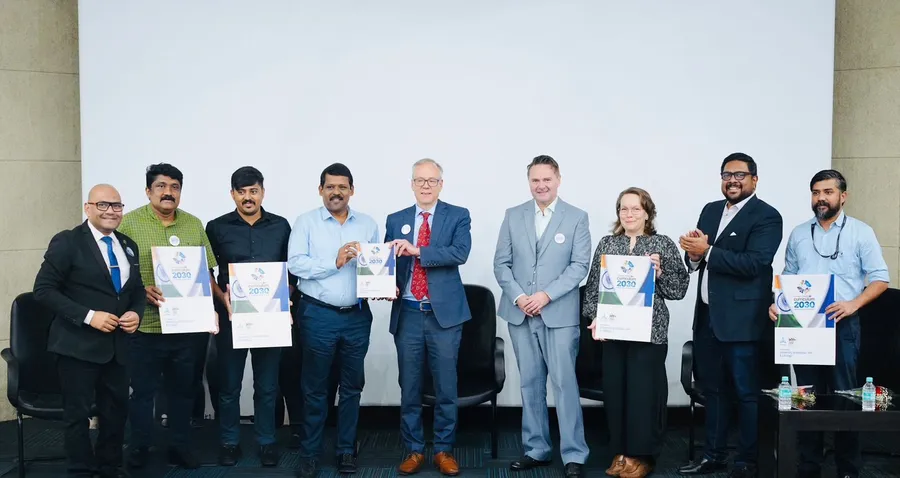 Representatives of the University of Helsinki, Lifology and VentureVillage holding copies of a newly launched publication.
